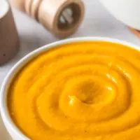 creamy smooth butternut cream cheese soup in a bowl