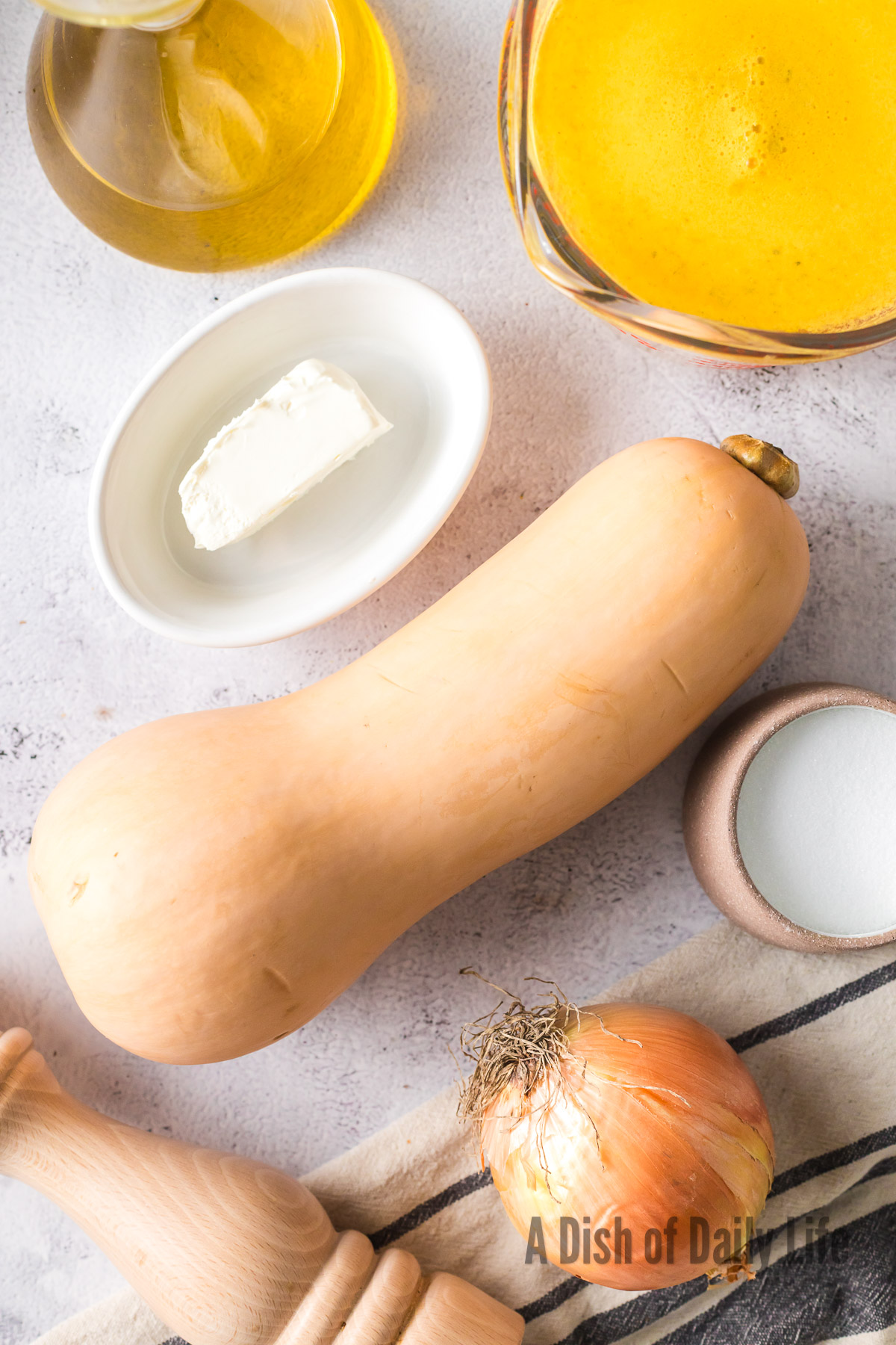 All ingredients for butternut squash soup laid out on counter