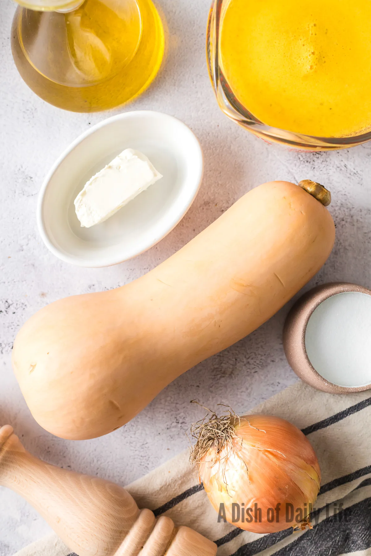 All ingredients for butternut squash soup laid out on counter