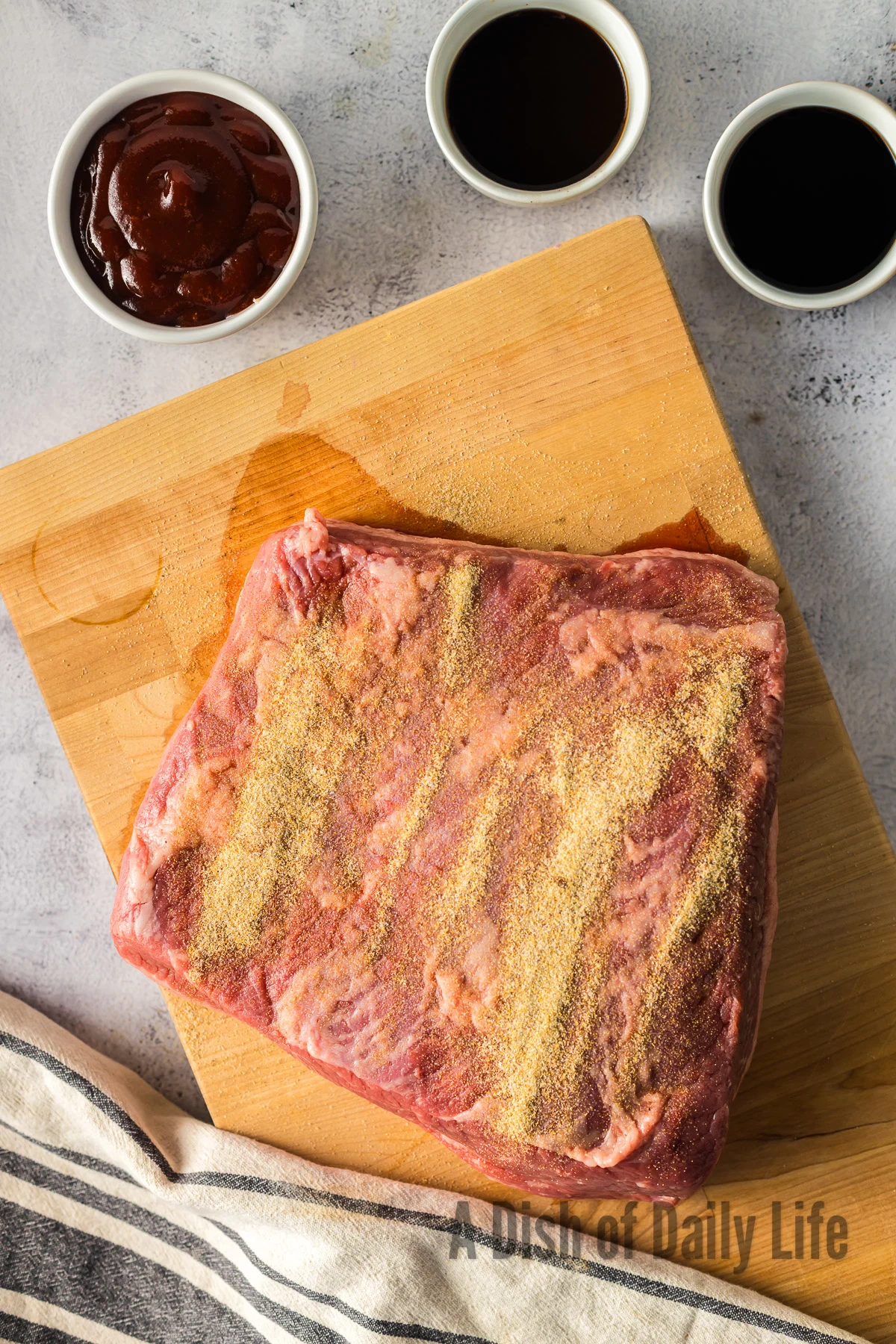 celery salt, garlic powder and onion salt mixed together and sprinkled on top of brisket