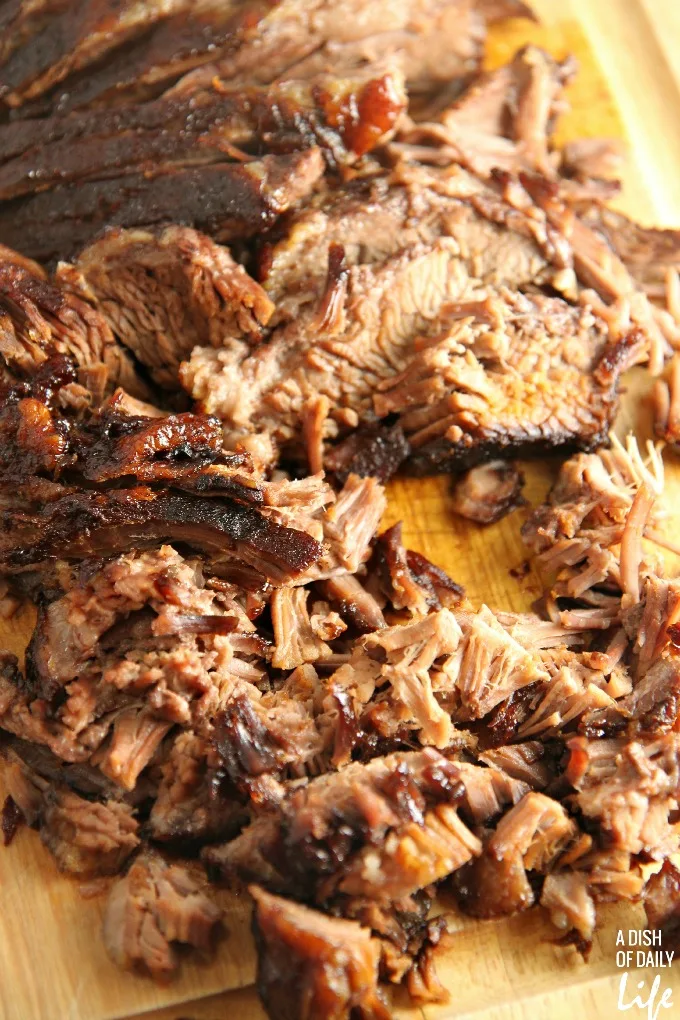 This mouthwatering Slow Cooked Barbeque Brisket recipe is a new family favorite! 10 minutes of prep time and just pop it in the oven to slow roast to perfection! Perfect easy weeknight meal or game day food!