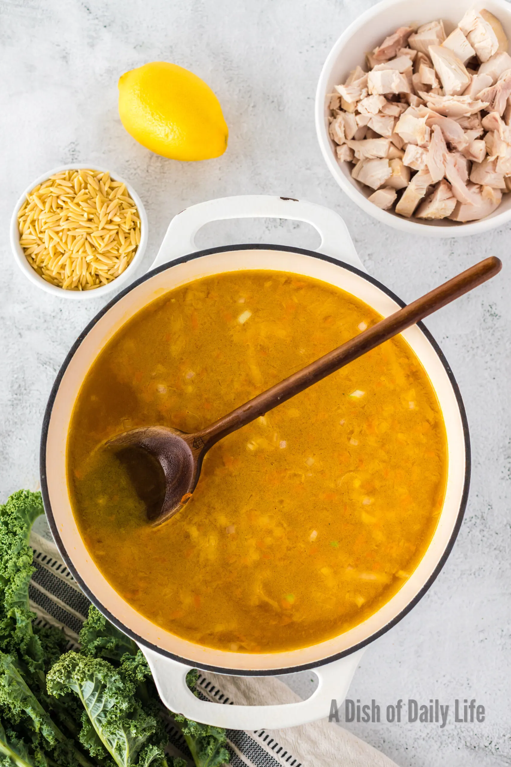 Chicken stock added to carrots and onions