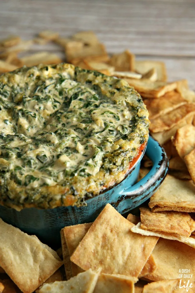 Creamy Spinach and Artichoke dip...perfect for game day or a holiday party! Your guests will never know how easy it was to make!