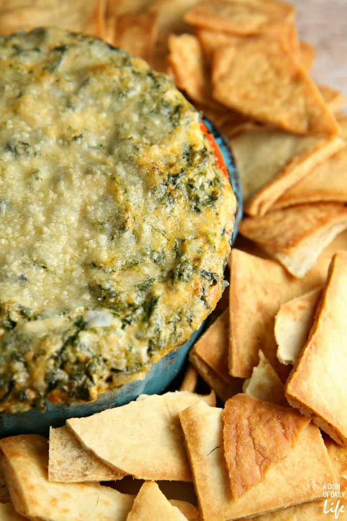Creamy Spinach and Artichoke dip...perfect for game day or a holiday party! Your guests will never know how easy it was to make!