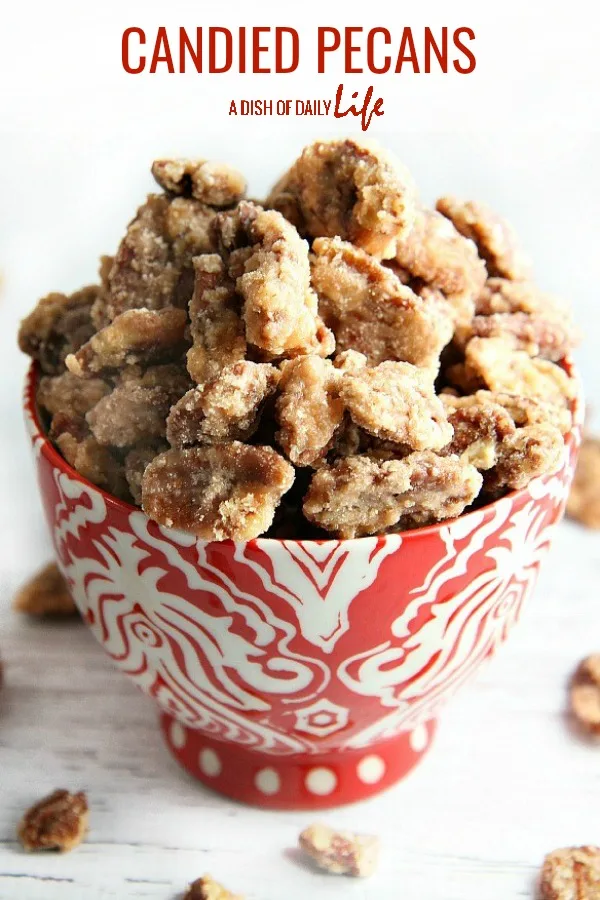 Candied pecans…great holiday gift, easy recipe for your Christmas cookie exchange, and a lovely addition to your holiday dessert table. Use them in salads and as a topping for desserts too. This is a MUST MAKE recipe this holiday season! #holidayfoodgifts #homemadegifts #Christmas #candiednuts #dessert #snack