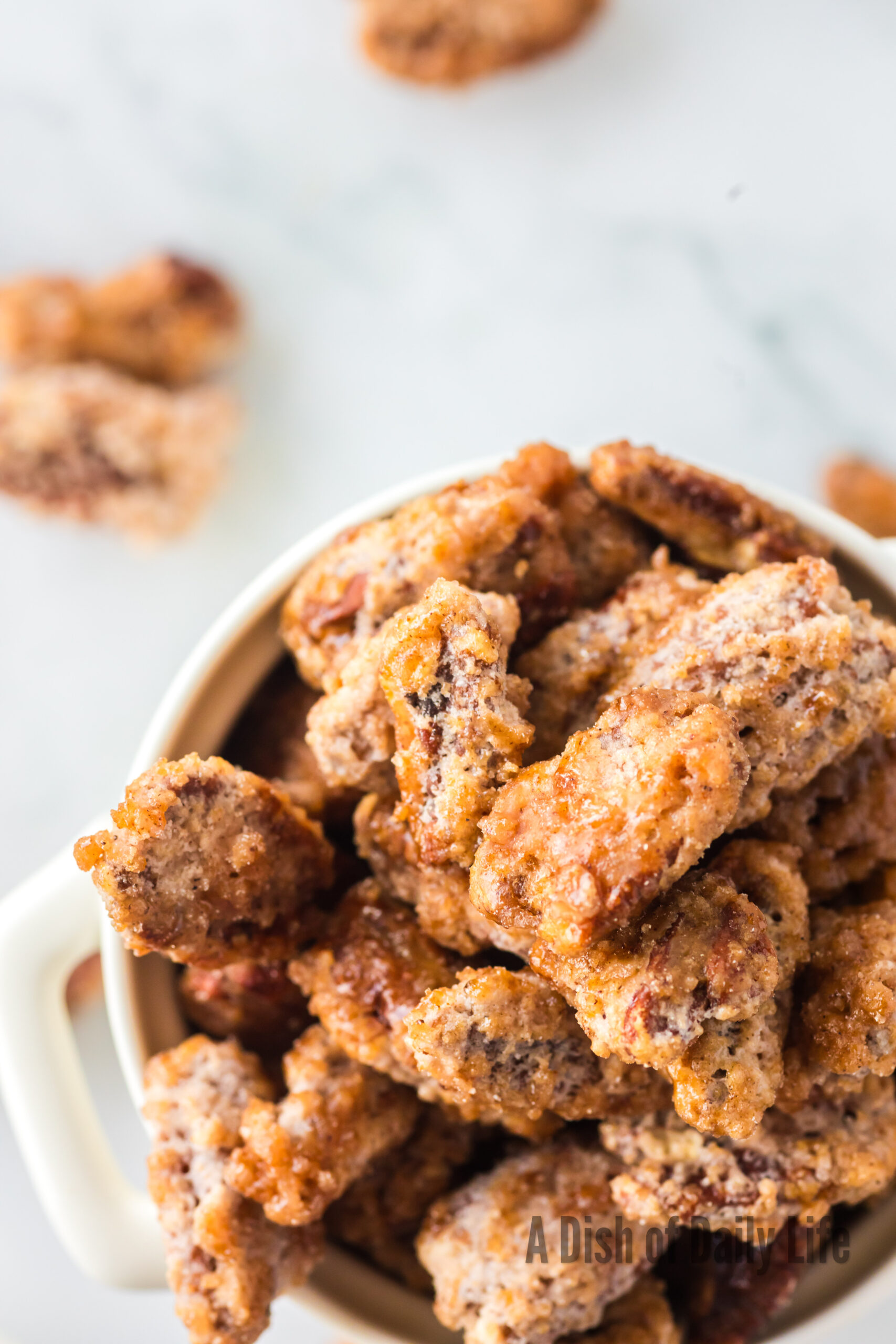 candied pecans in a dish ready to be served