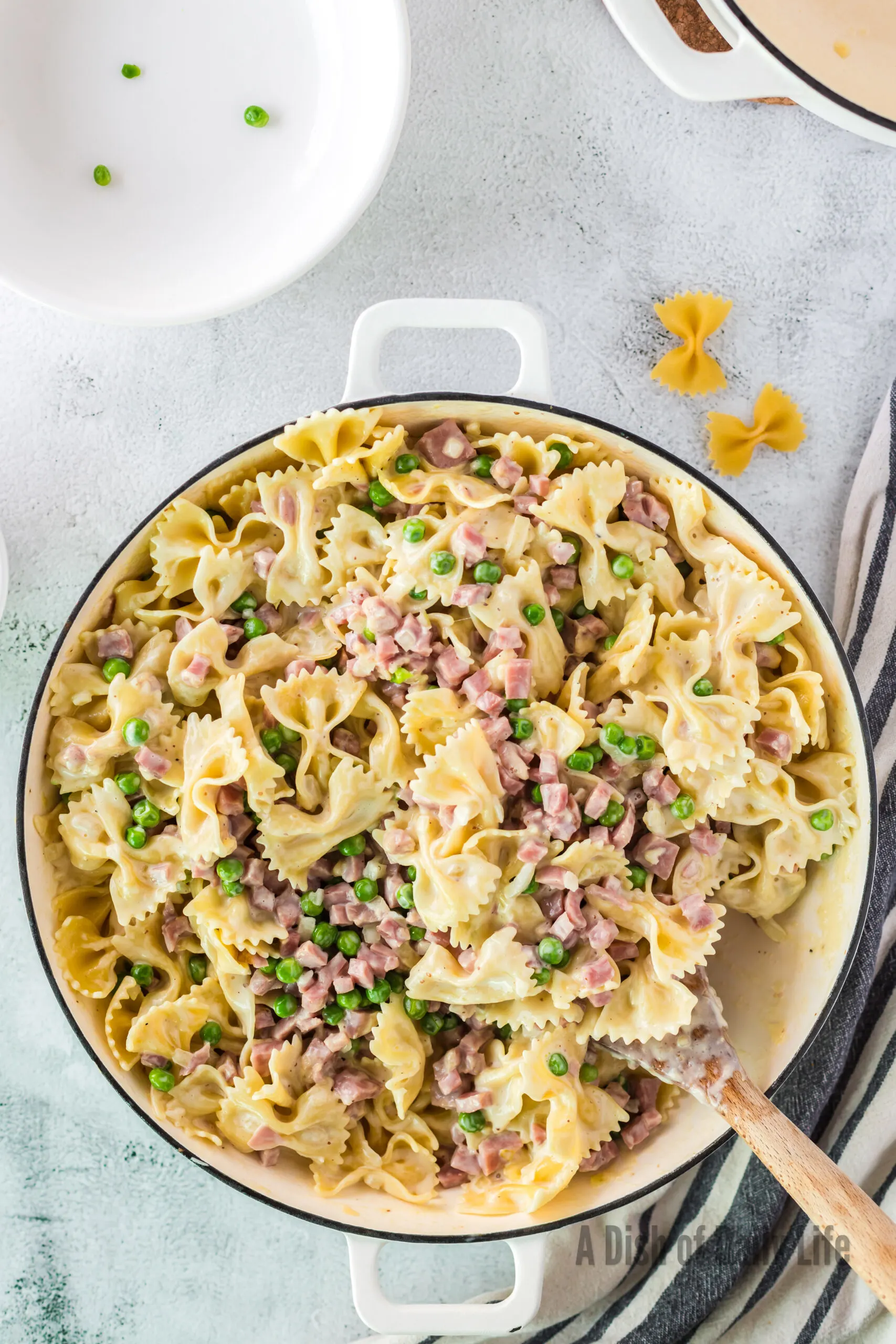 zoomed out image of ham and pea pasta in cooking pot