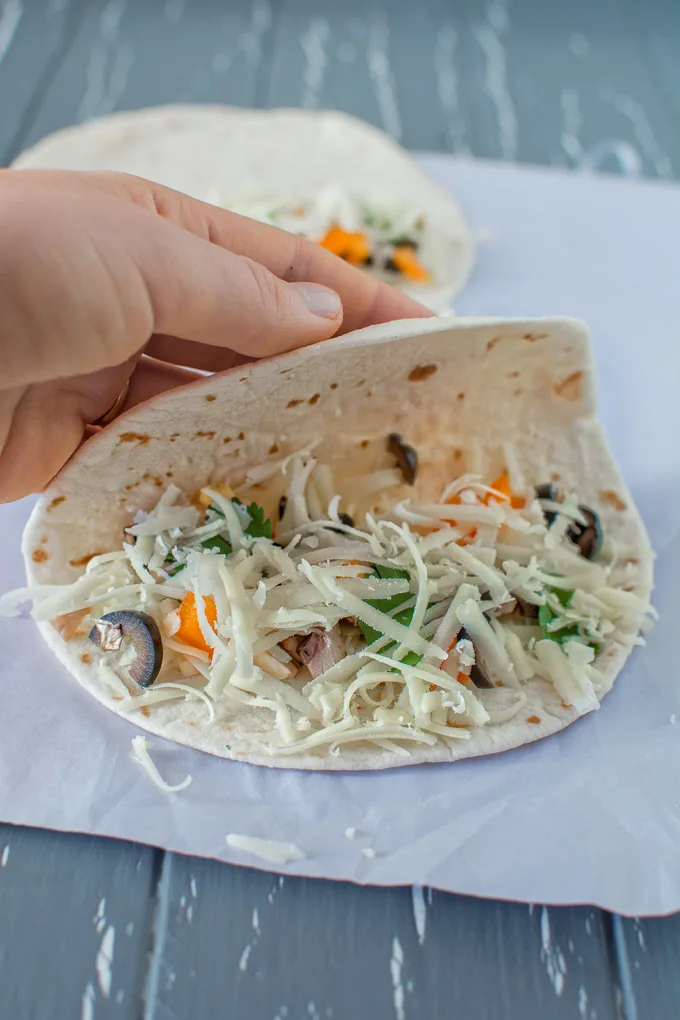 This 15-minute, healthy vegetarian Mediterranean Quesadilla filled with mushrooms, olives and bell peppers can serve as a quick lunch or a light dinner. Serve it with guacamole or a fresh salad. Great recipe for game day too!