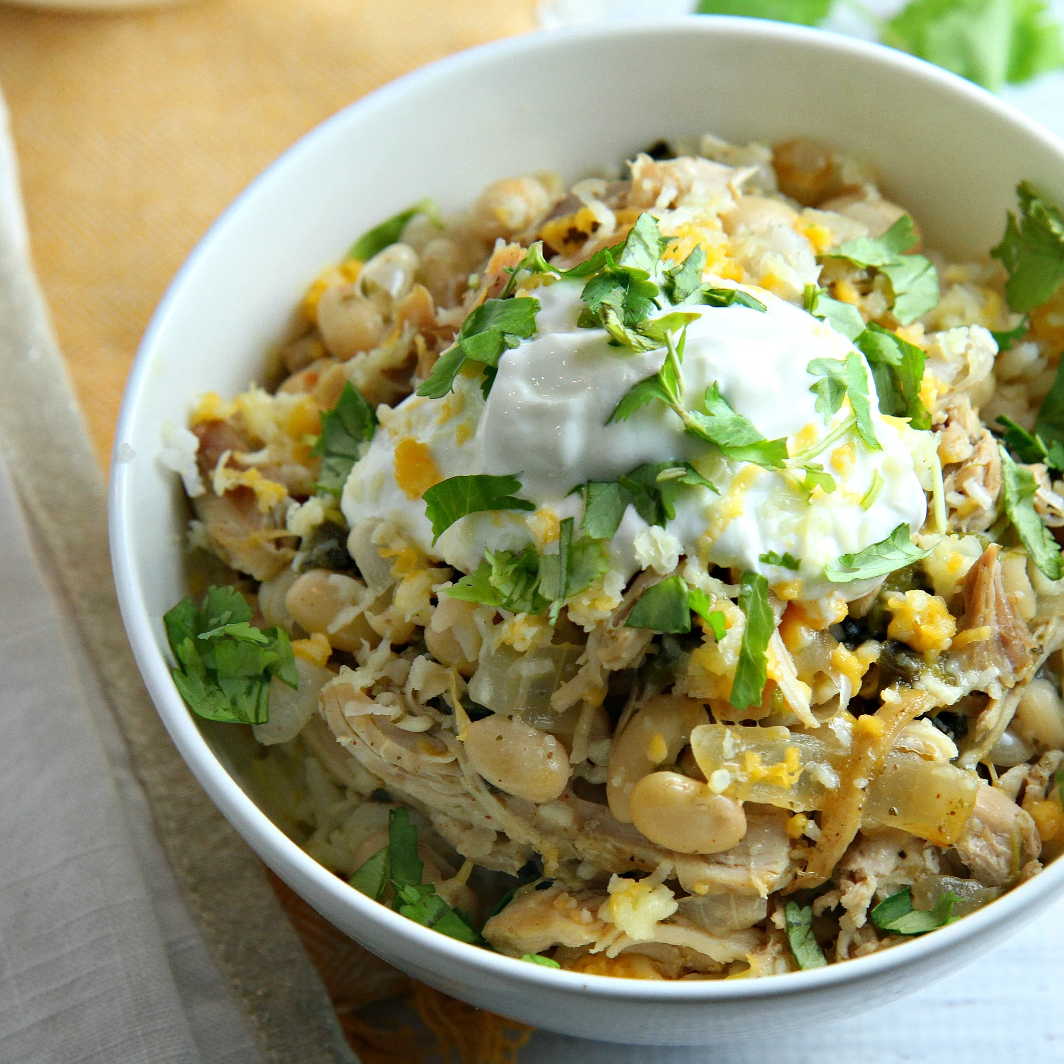 White Bean Chicken Chili is a healthy and delicious easy weeknight meal, but it's also perfect for game day. Guaranteed to be a hit with kids and adults alike!