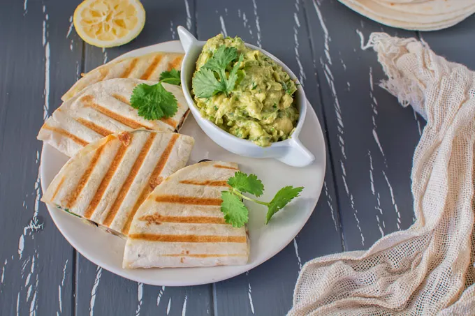 This 15-minute, healthy vegetarian Mediterranean Quesadilla filled with mushrooms, olives and bell peppers can serve as a quick lunch or a light dinner. Serve it with guacamole or a fresh salad. Great recipe for game day too!