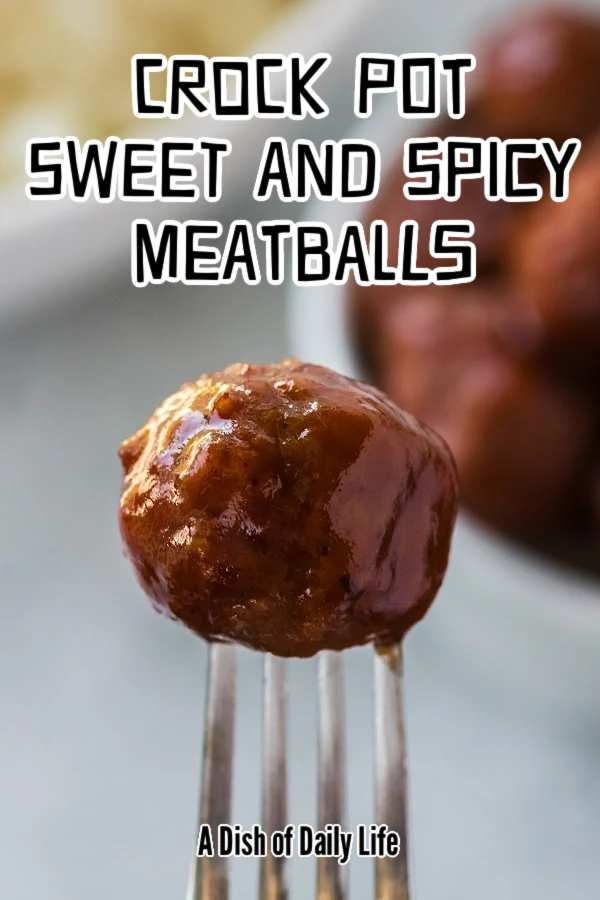 Main image for Crock Pot Sweet and Sour Meatballs recipe. Fork holding a meatball