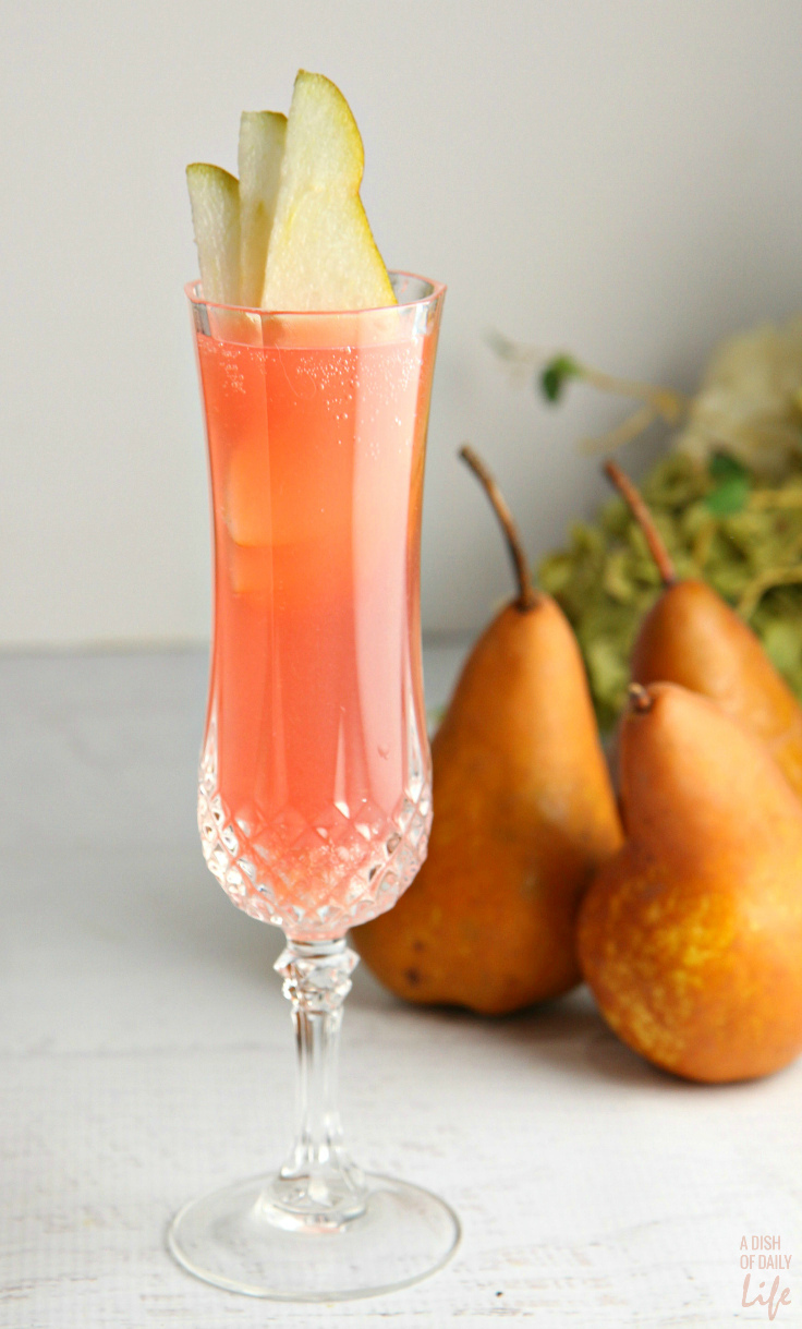 This Cranberry Pear Prosecco cocktail recipe is amazingly refreshing with a delicate fizz - an easy spring cocktail that you can make in just 5 minutes! It's perfect for your Easter dinner, Mother's Day brunch, wedding and baby showers, or any other spring (or summer) celebration!