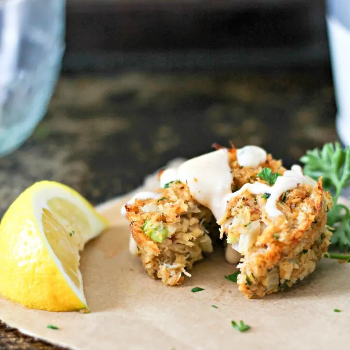 Crab cakes are a great appetizer or main dish for dinner! Muffin Tin Crab Cakes are full of lump crab meat and have the right amount of spice! Drizzle with Old Bay Remoulade for a treat that will take you to the sea! Mini Muffin Tin Crab Cakes with Old Bay Remoulade Recipe | Take Two Tapas