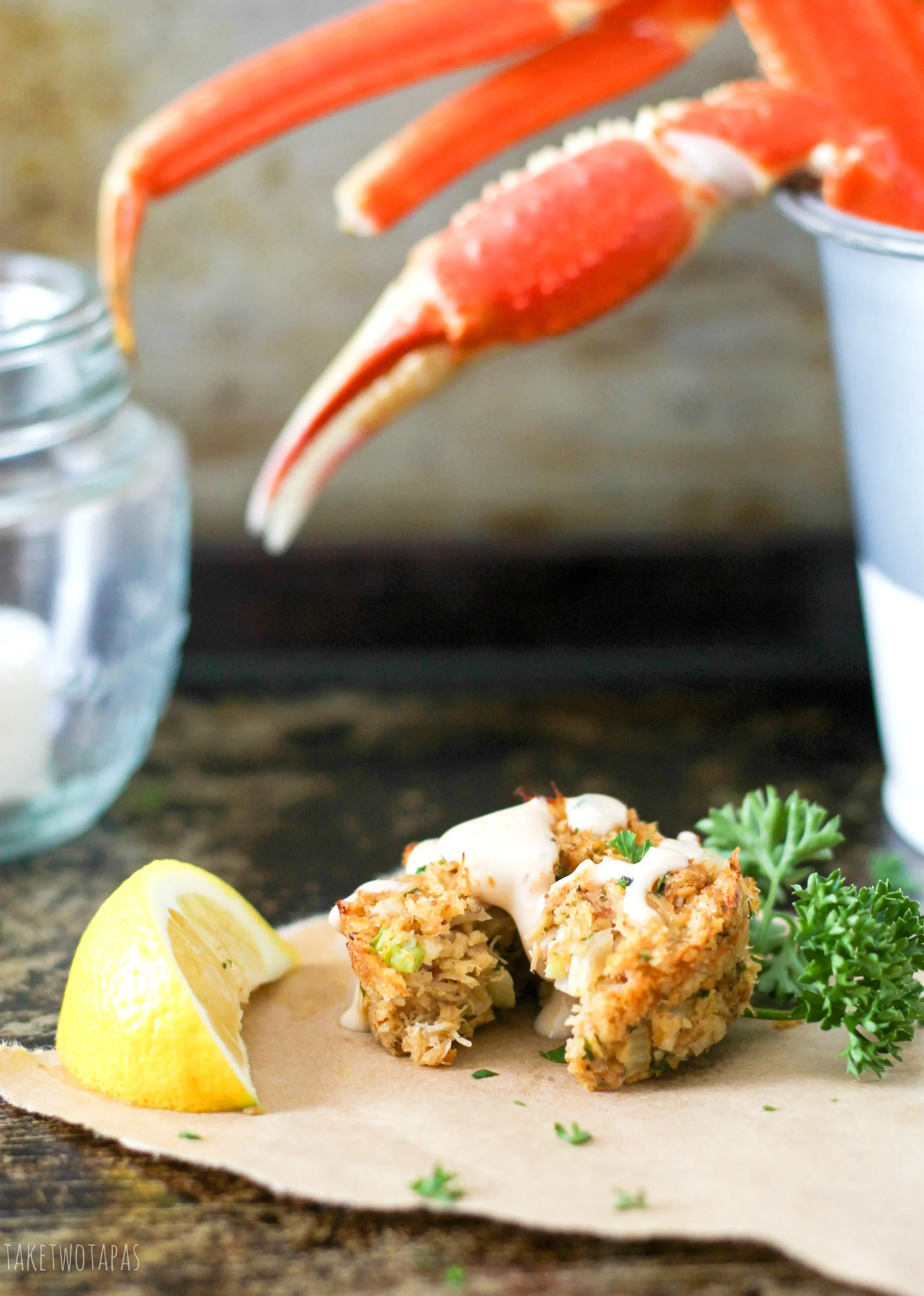 Crab cakes are a great appetizer or main dish for dinner! This Muffin Tin Crab Cakes recipe is full of lump crab meat and have the right amount of spice! Drizzle with Old Bay Remoulade for a treat that will take you to the sea! 