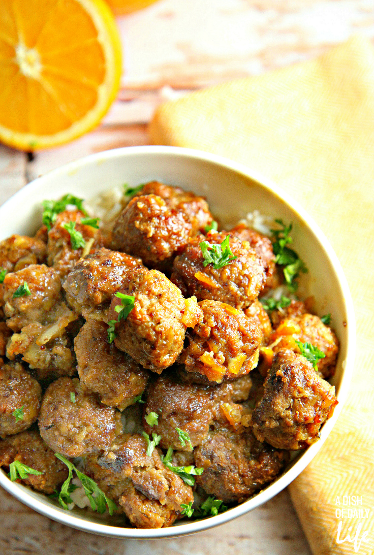 Slow Cooker Pork Meatballs with Orange Sauce...tender, juicy meatballs, packed with vegetables, covered with an orange glaze that everyone goes crazy for! Great as a party appetizer recipe, or delicious easy dinner with rice! Leftovers freeze well. 