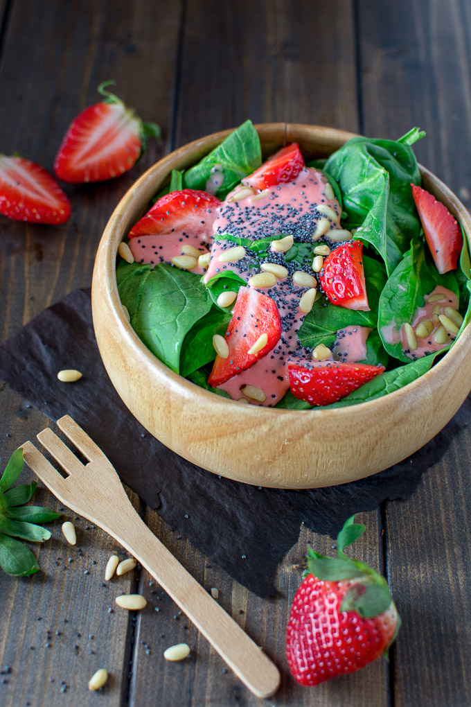 Colorful and healthy, this Simple Spinach and Strawberry Salad recipe makes a great lunch and can be easily customized for dinner by adding grilled chicken and feta. The strawberry dressing is the best in the world! 
