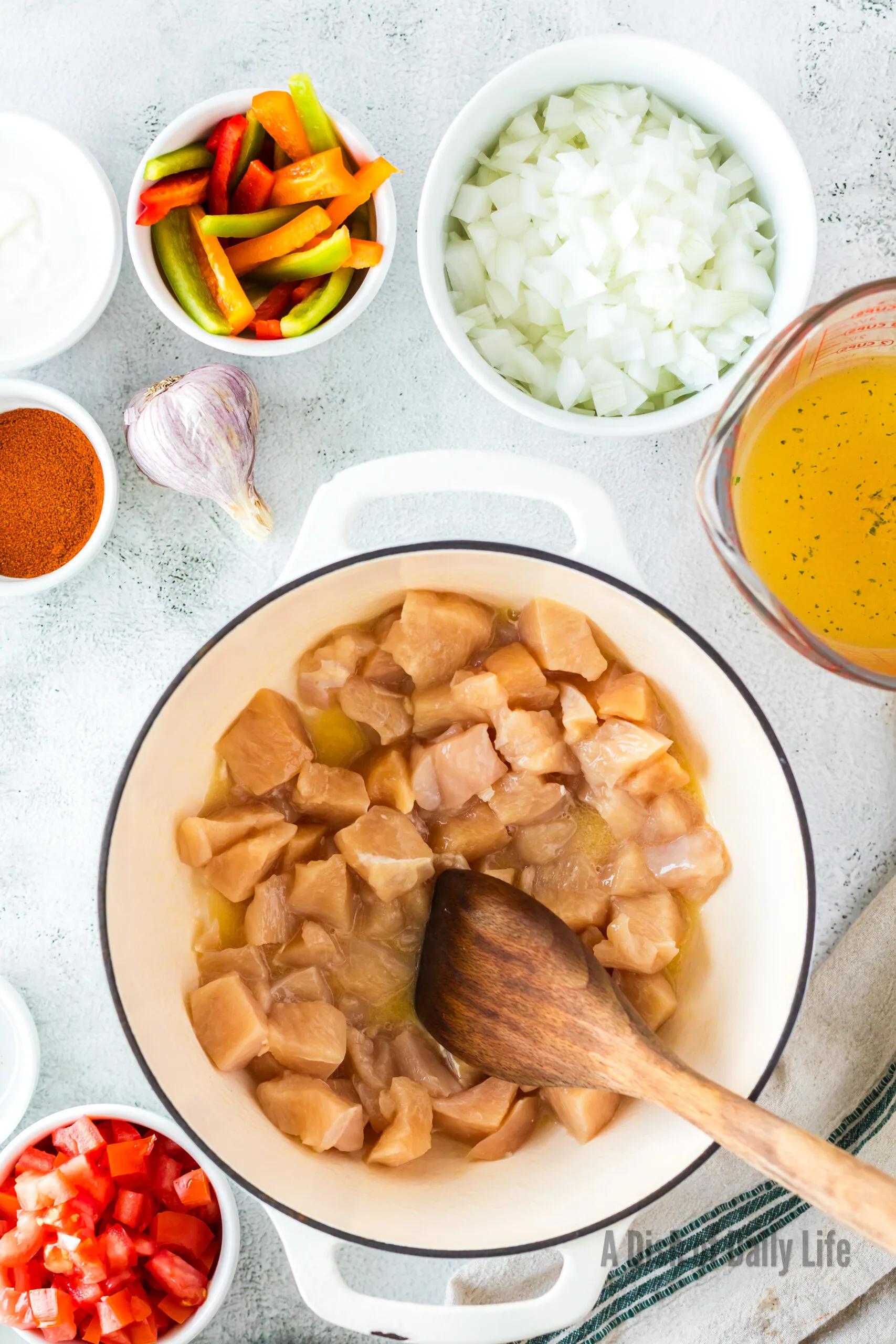 Butter, olive oil and chicken in a pot, ready to cook.