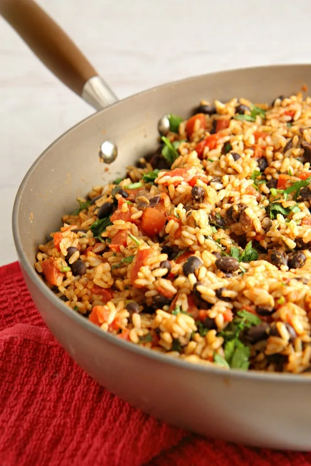 Mexican Rice and Beans...an easy versatile vegetarian dish! Use it as a side dish for Mexican night, use the leftovers as a filling for burritos along with chicken or beef, or add cheese and turn it into a Mexican bake.