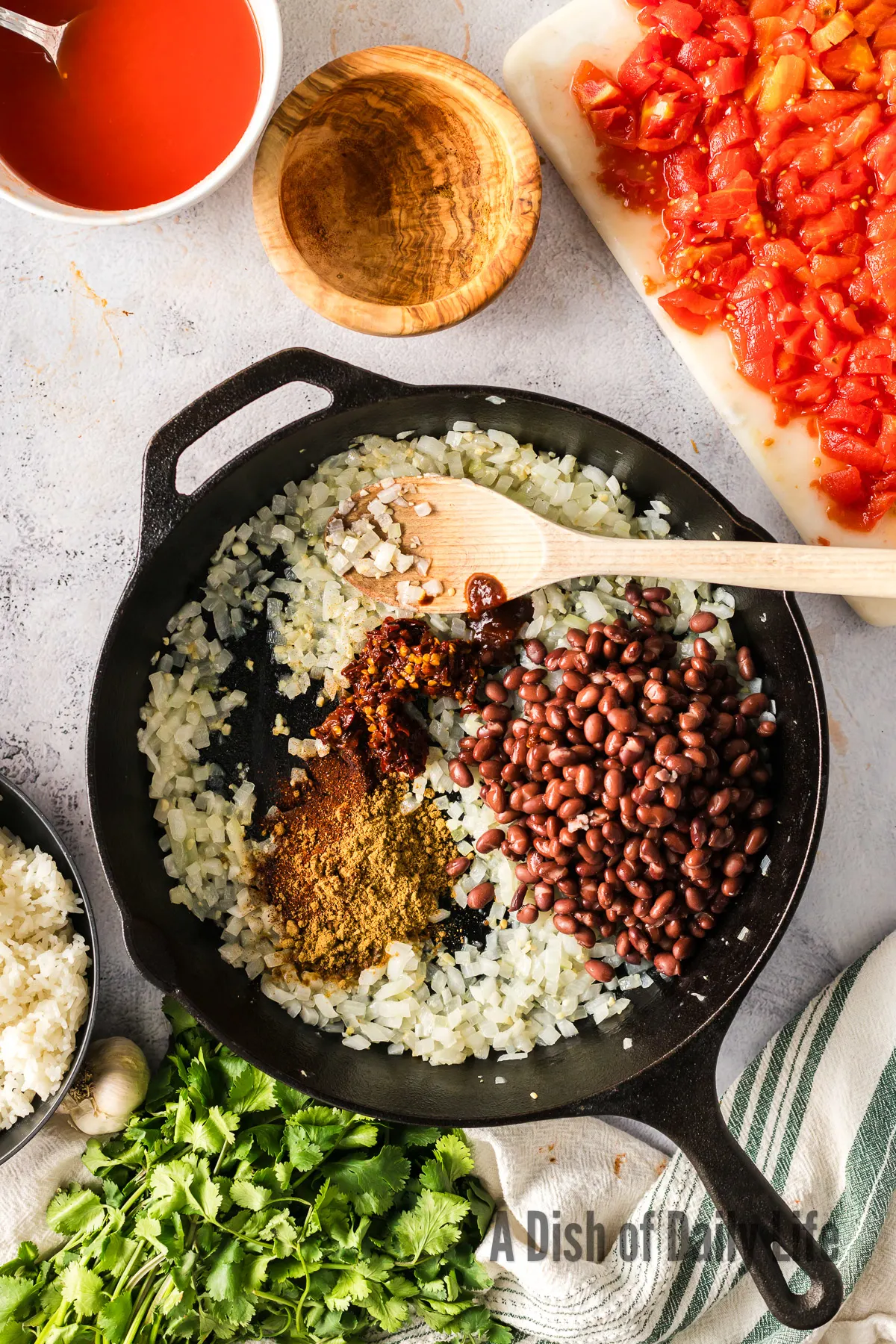 cumin, chili powder, black beans and chipotle peppers added to cooked onion mixture.