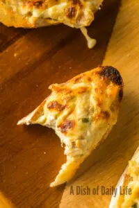 zoomed in image with a bite removed from a bruschetta