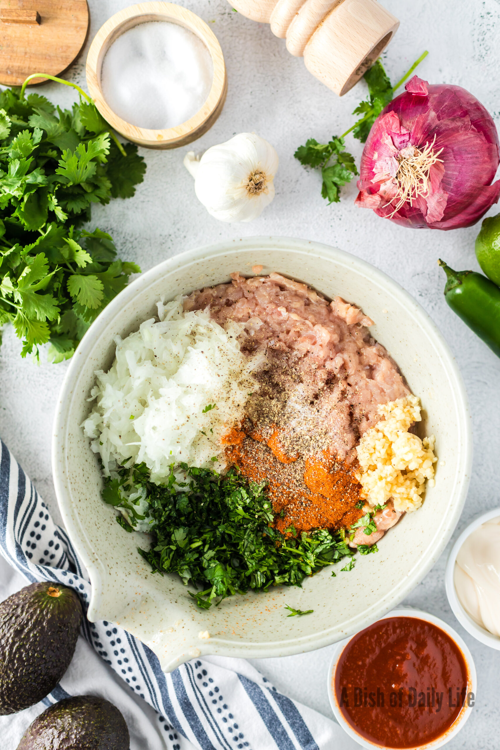 Ground Chicken, Onion, Garlic, Paprika, Cilantro, salt and pepper in a bowl, unmixed