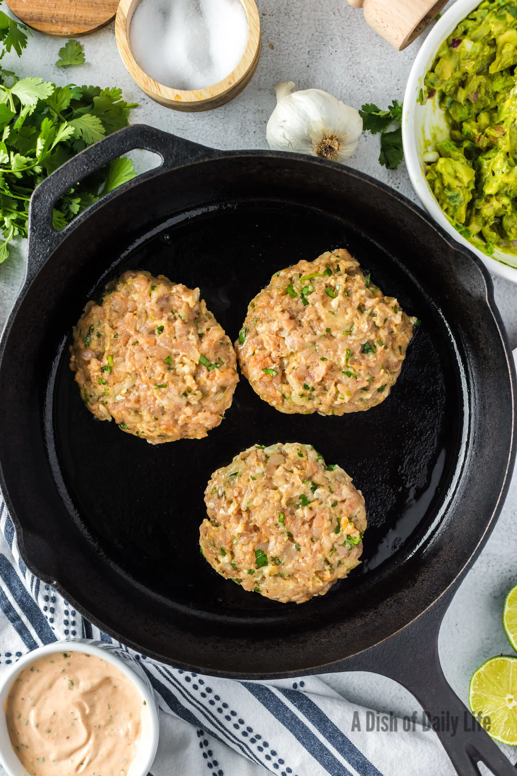 Burgers cooking in a skillet