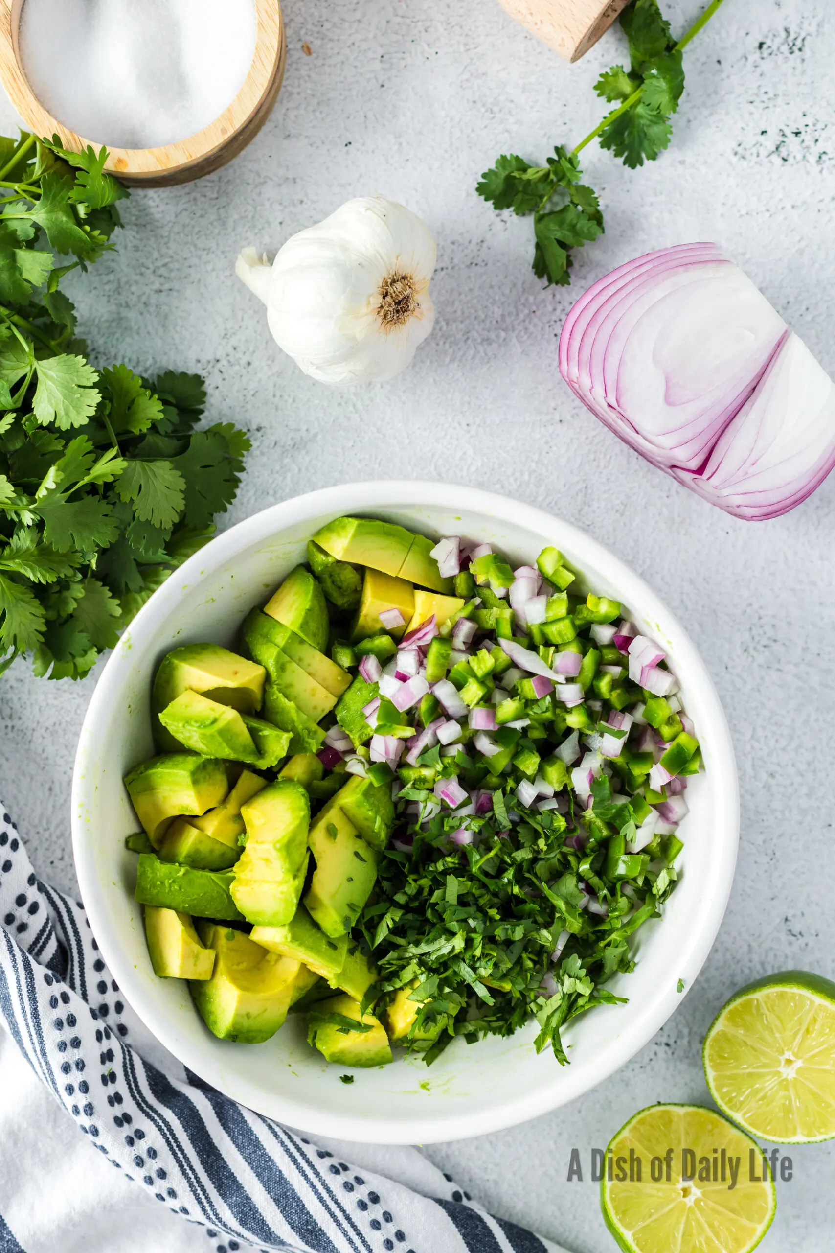 Avocados, jalapeno, red onion, lime juice and cilantro in a bowl