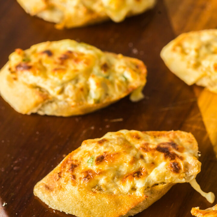 zoomed in image of canned clam mixture spread on a baguette