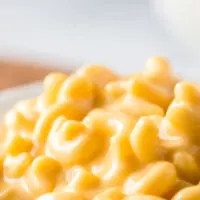 close up of cheesy macaroni in bowl