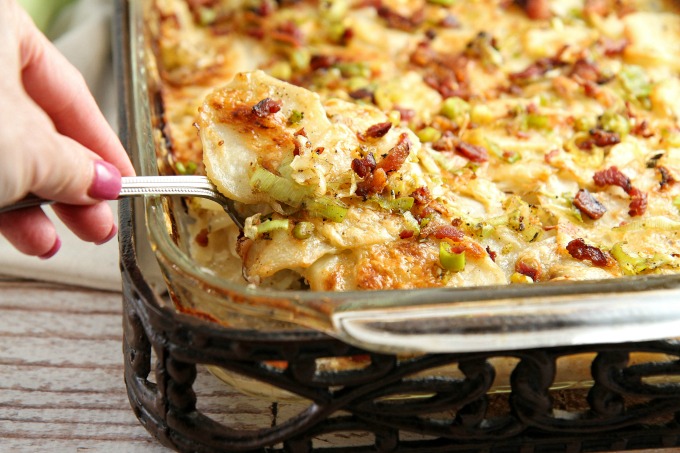 These Cheesy Potatoes with bacon and leeks are packed with creamy goodness, and make a great side dish for any holiday or special occasion dinner! This comfort food casserole is a tried and true family favorite! Family and friends will be begging you for the recipe!