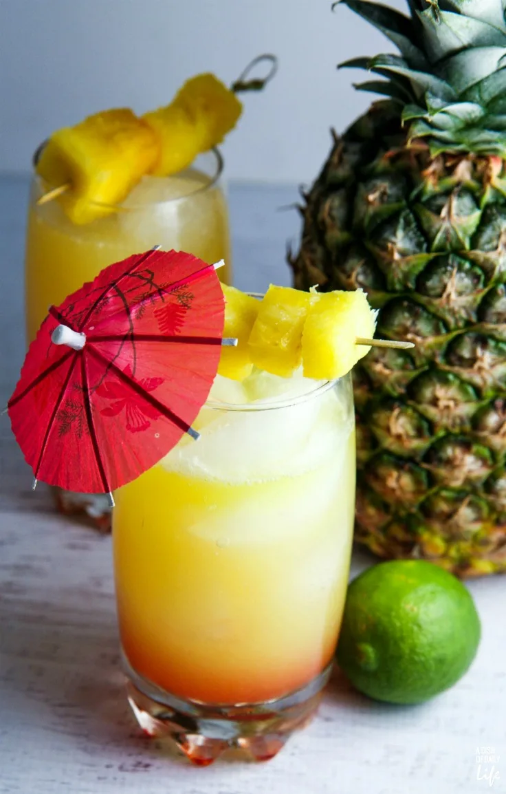 You'll feel like you're on an tropical vacation when you're sipping this easy Rum Punch with pineapple and coconut! Perfect cocktail recipe for summer entertaining!