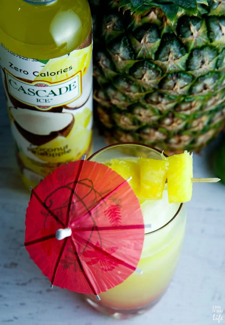 You'll feel like you're on an tropical vacation when you're sipping this easy Rum Punch with pineapple and coconut! Perfect cocktail recipe for summer entertaining!