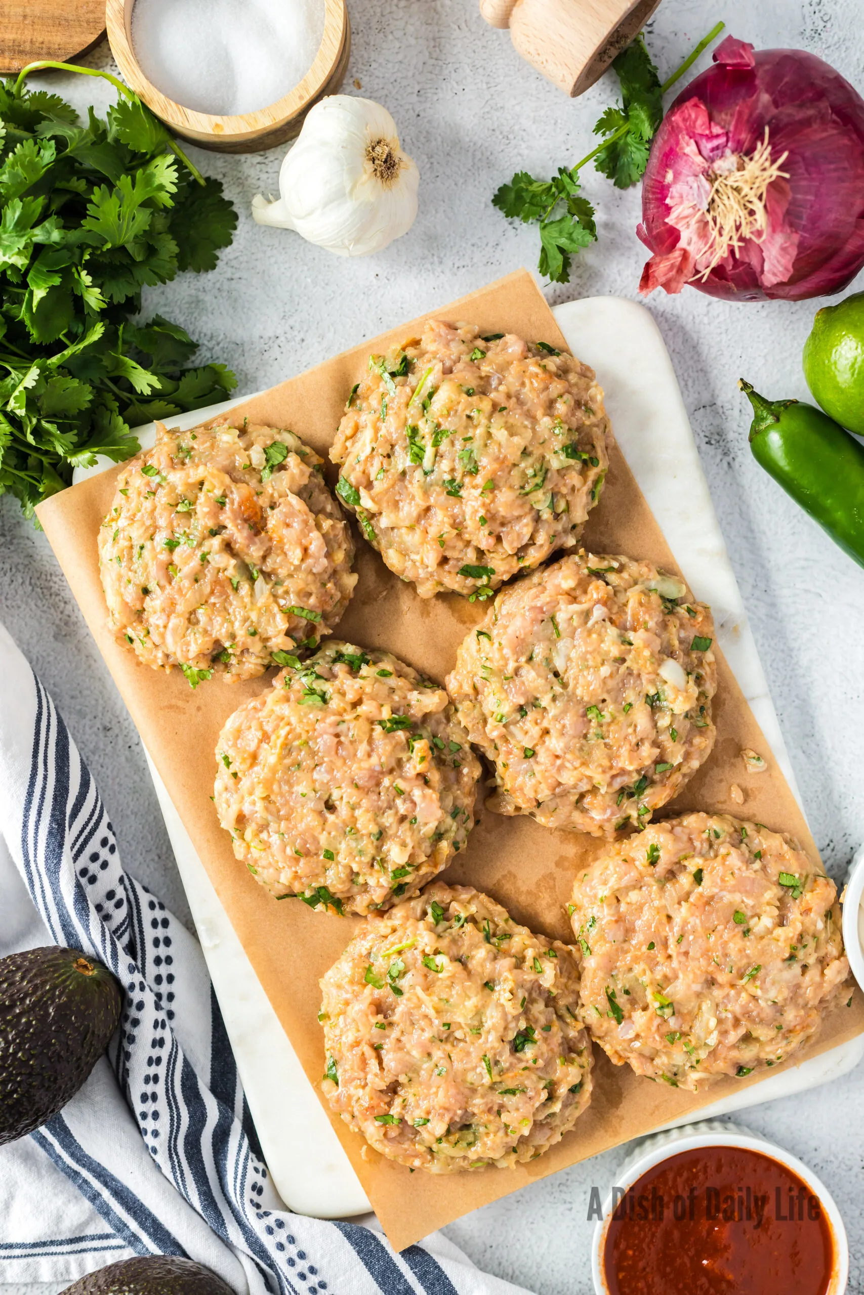 6 patties created and laid out on parchment paper