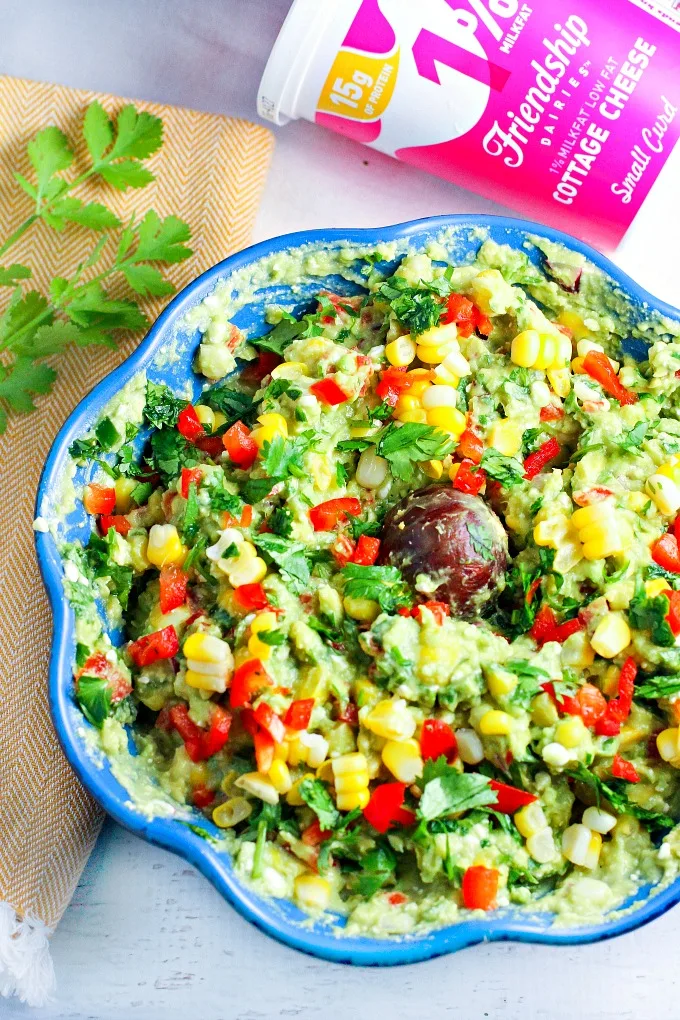 Fiesta Guacamole...a healthy snack packed with vegetables and extra protein for fueling muscle recovery after a tough workout! This easy to make appetizer recipe is perfect for parties and Mexican night as well!