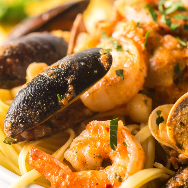 seafood pasta layered up on a serving plate