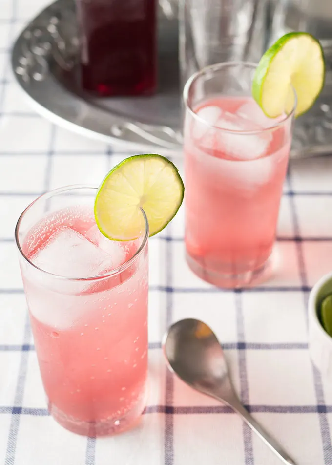 This vodka spritzer is made with a simple syrup of fresh cherries and cilantro and promises to keep you cool all summer long.