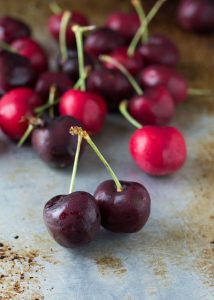 This vodka spritzer is made with a simple syrup of fresh cherries and cilantro and promises to keep you cool all summer long.
