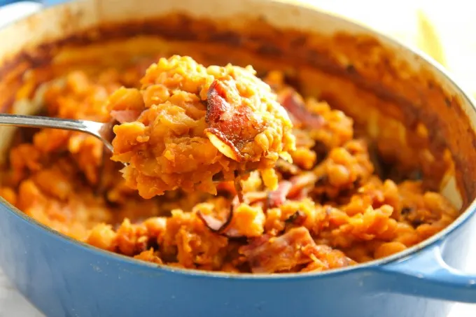 You can't have a summer BBQ without Baked Beans from Scratch! This easy-to-make comfort food side dish is slow cooked in a tangy sweet and savory sauce...so much tastier than the canned version! 