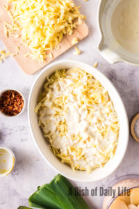 Potatoes and cheese with cream poured over the top.