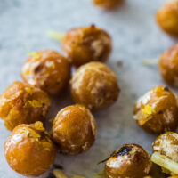 a few chickpeas scattered on counter and ready to eat