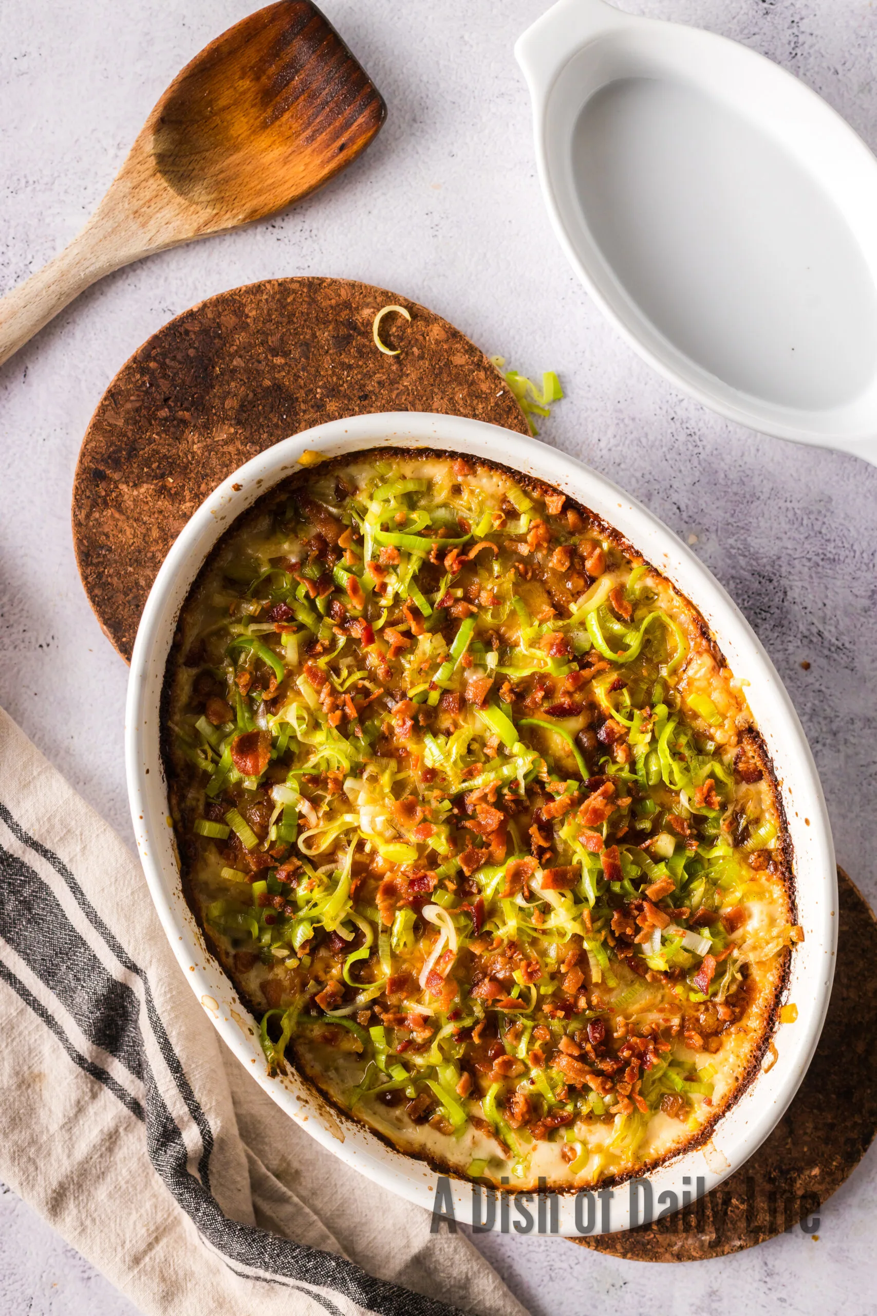 Fresh baked potato leek gratin in casserole dish