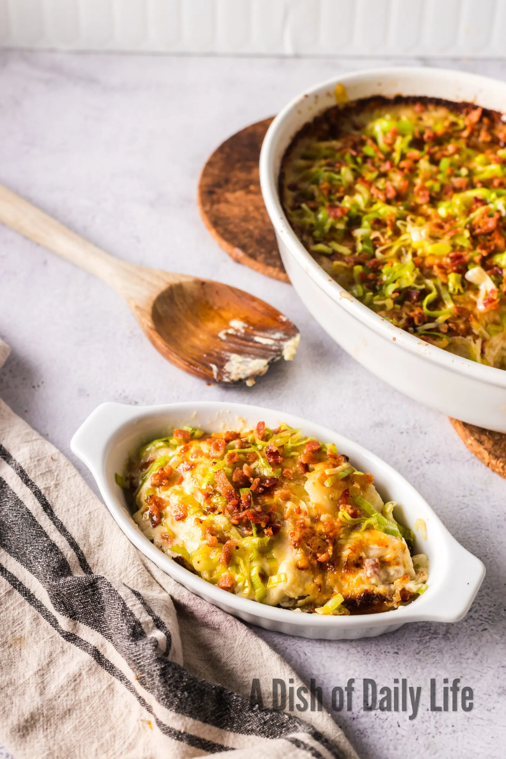A small portion scooped out of casserole dish and onto a small dish.