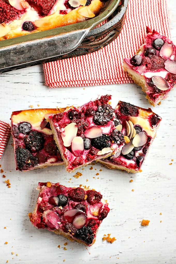 This easy-to-make scrumptious Berry Cheesecake Bars recipe will satisfy any sweet tooth craving! Perfect for for tailgating parties or movie night!