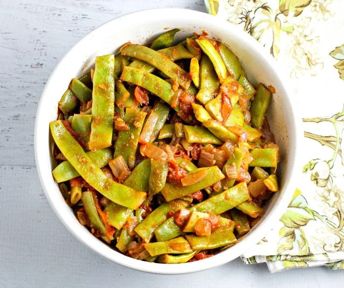 Pick some Romano beans up at the farmer's market this week! Flavorful and easy, Romano Beans with tomatoes is a side dish recipe that goes with just about anything. Definitely a family favorite!