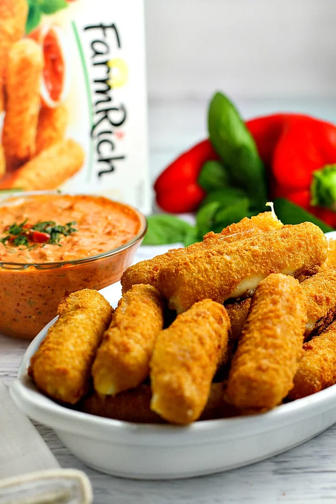 This easy 5 minute Roasted Red Pepper Dip recipe is a delicious way to dress up mozzarella sticks or cut up vegetables on game day!