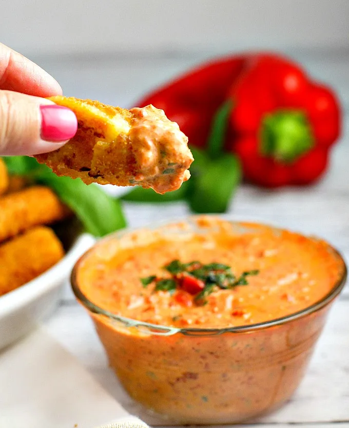 This easy 5 minute Roasted Red Pepper Dip recipe is a delicious way to dress up mozzarella sticks or cut up vegetables on game day!