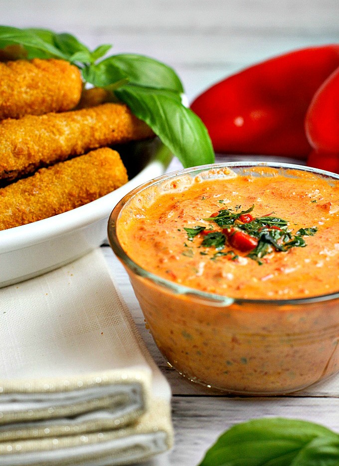This easy 5 minute Roasted Red Pepper Dip recipe is a delicious way to dress up mozzarella sticks or cut up vegetables on game day!