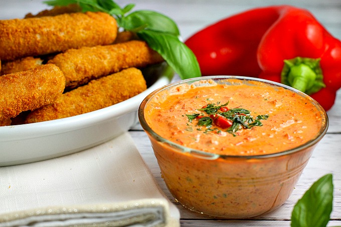 This easy 5 minute Roasted Red Pepper Dip recipe is a delicious way to dress up mozzarella sticks or cut up vegetables on game day!