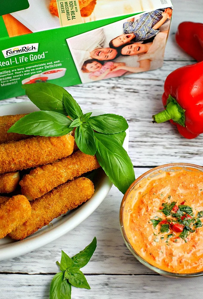 This easy 5 minute Roasted Red Pepper Dip recipe is a delicious way to dress up mozzarella sticks or cut up vegetables on game day!