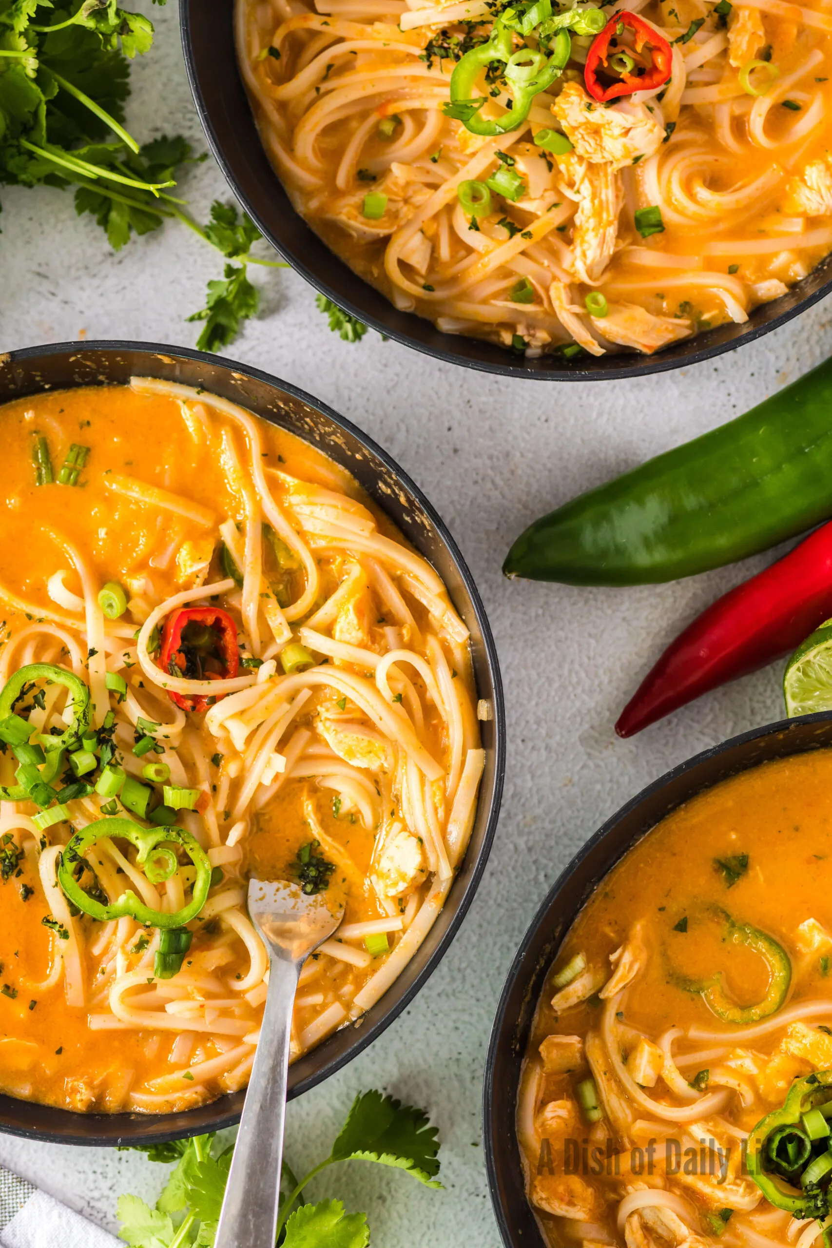 close up of 3 bowls of soup